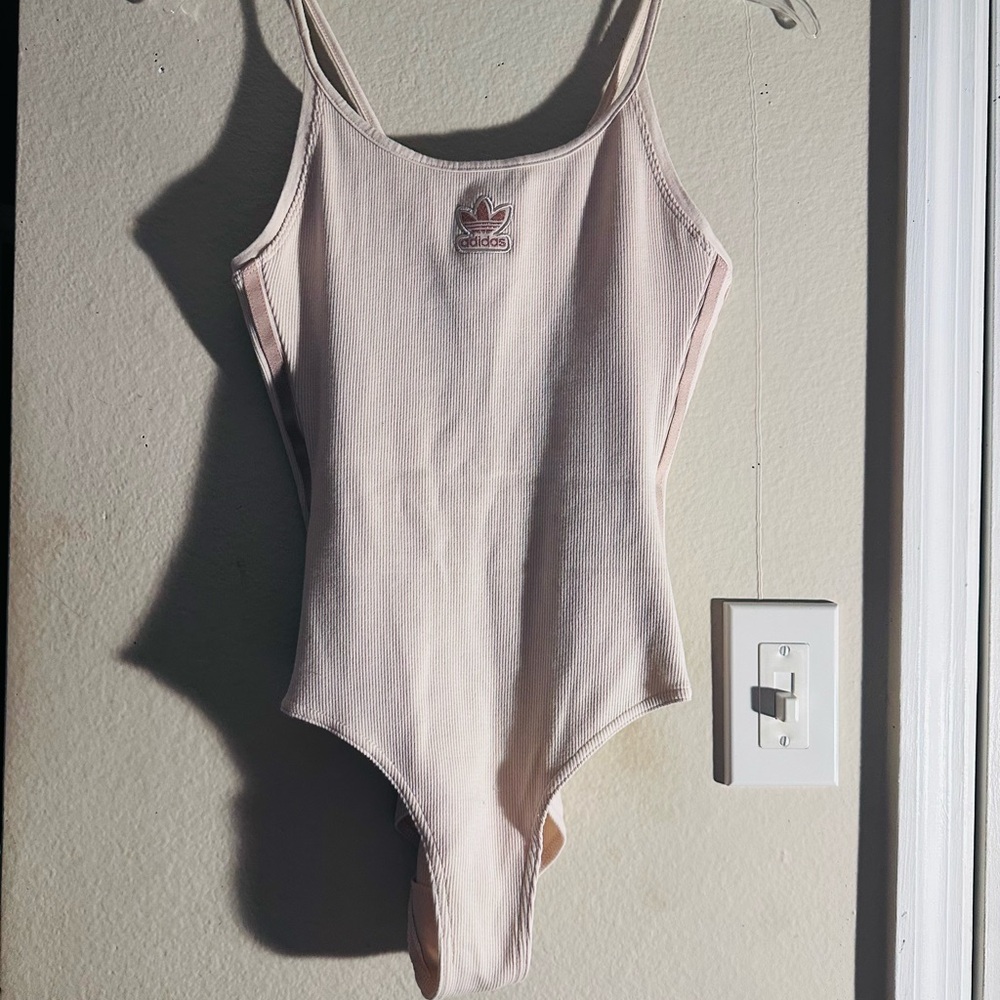 Adidas  Bodysuit One Piece with High-Cut Design . Color cream . Used condition .